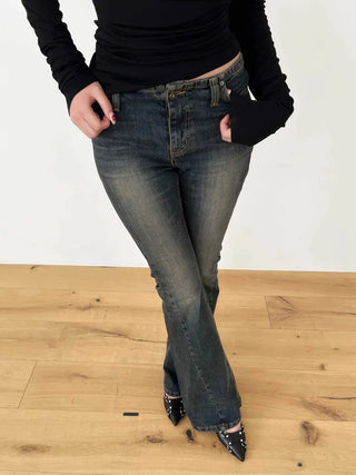 Curved low-rise slim bootcut denim pants