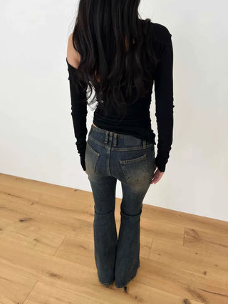 Curved low-rise slim bootcut denim pants