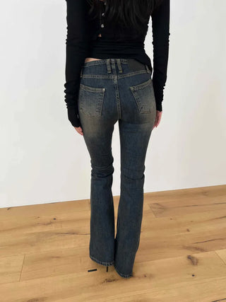 Curved low-rise slim bootcut denim pants
