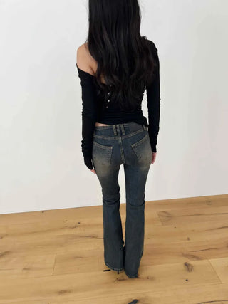 Curved low-rise slim bootcut denim pants
