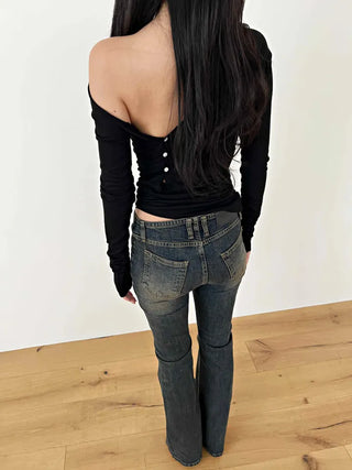 Curved low-rise slim bootcut denim pants