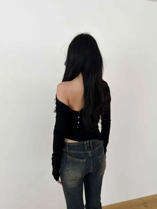 Curved low-rise slim bootcut denim pants