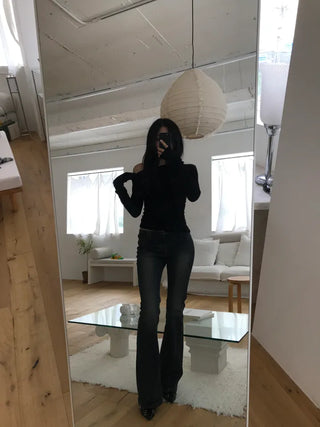 Curved low-rise slim bootcut denim pants