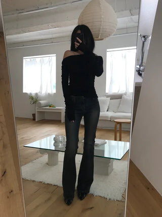 Curved low-rise slim bootcut denim pants
