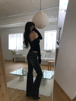 Curved low-rise slim bootcut denim pants