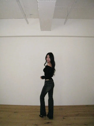 Curved low-rise slim bootcut denim pants