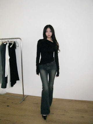 Curved low-rise slim bootcut denim pants