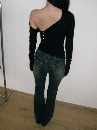 Curved low-rise slim bootcut denim pants