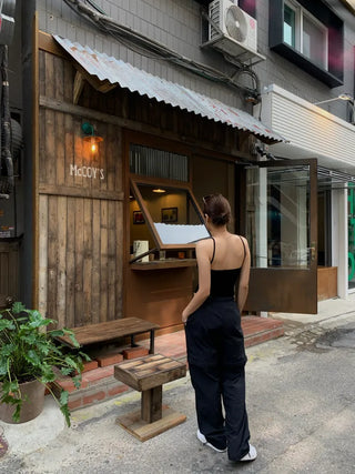 Backless ribbed sleeveless top with built-in cap