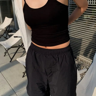 Backless ribbed sleeveless top with built-in cap