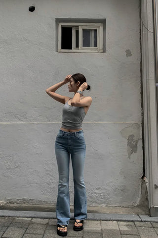 Sleeveless top with built-in cap