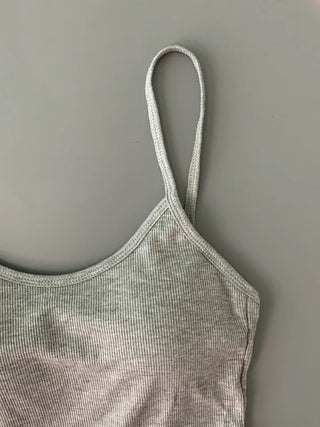 Sleeveless top with built-in cap