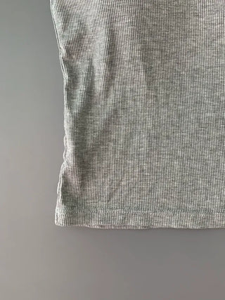 Sleeveless top with built-in cap