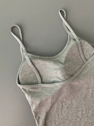 Sleeveless top with built-in cap