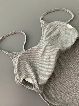 Sleeveless top with built-in cap