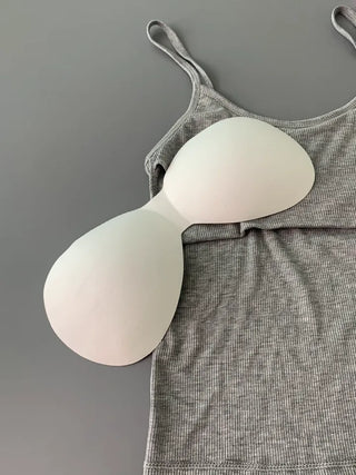 Sleeveless top with built-in cap