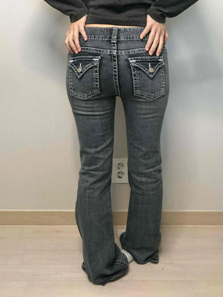 Low-rise bootcut washed denim pants