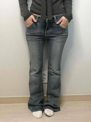 Low-rise bootcut washed denim pants