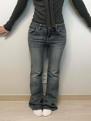 Low-rise bootcut washed denim pants