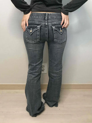 Low-rise bootcut washed denim pants