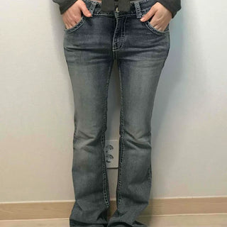 Low-rise bootcut washed denim pants