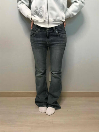 Low-rise bootcut washed denim pants