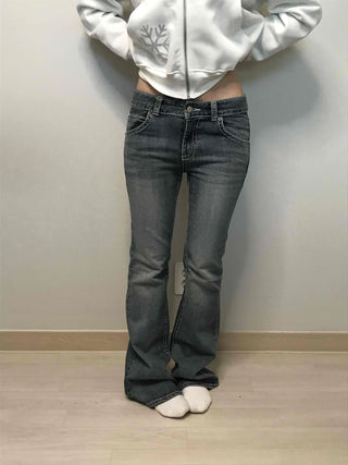 Low-rise bootcut washed denim pants