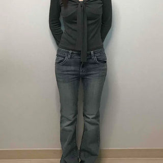 Low-rise bootcut washed denim pants