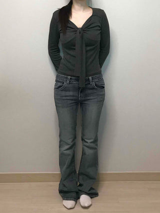 Low-rise bootcut washed denim pants