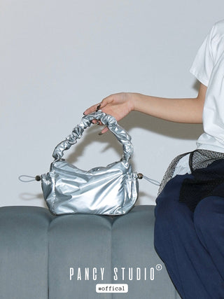 Smooth cream pleated handbag