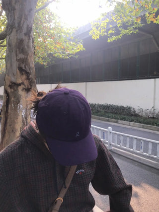purple baseball cap