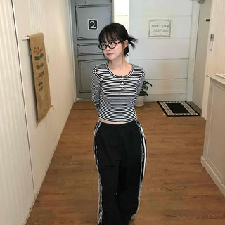 Minimalist button-punched striped T-shirt