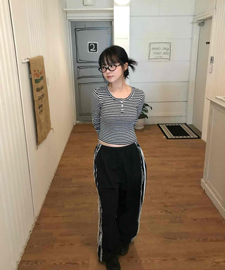 Minimalist button-punched striped T-shirt