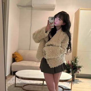 High-neck diagonal midi-length fur jacket