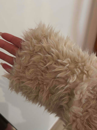 High-neck diagonal midi-length fur jacket