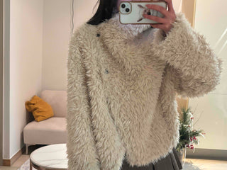 High-neck diagonal midi-length fur jacket