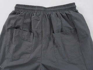 Crisp Nylon Rivet Elastic Waist Long Pants