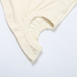 Crewneck irregular hollow out sleeveless solid cut out top