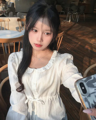 Punched ruffle long-sleeve blouse