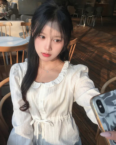 Punched ruffle long-sleeve blouse