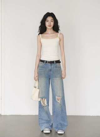 blue ripped jeans