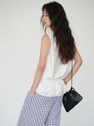 white sleeveless top