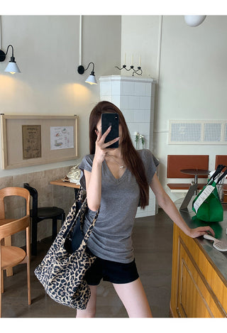 gray V-neck top