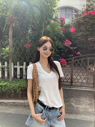 white V-neck top