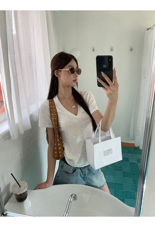white V-neck top