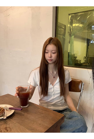 white V-neck top