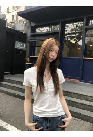 white V-neck top