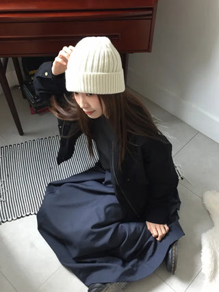 Black loose-fit jacket that accentuates a delicate silhouette