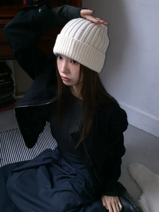 Black loose-fit jacket that accentuates a delicate silhouette