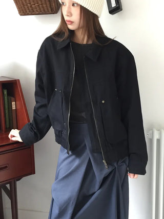 Black loose-fit jacket that accentuates a delicate silhouette